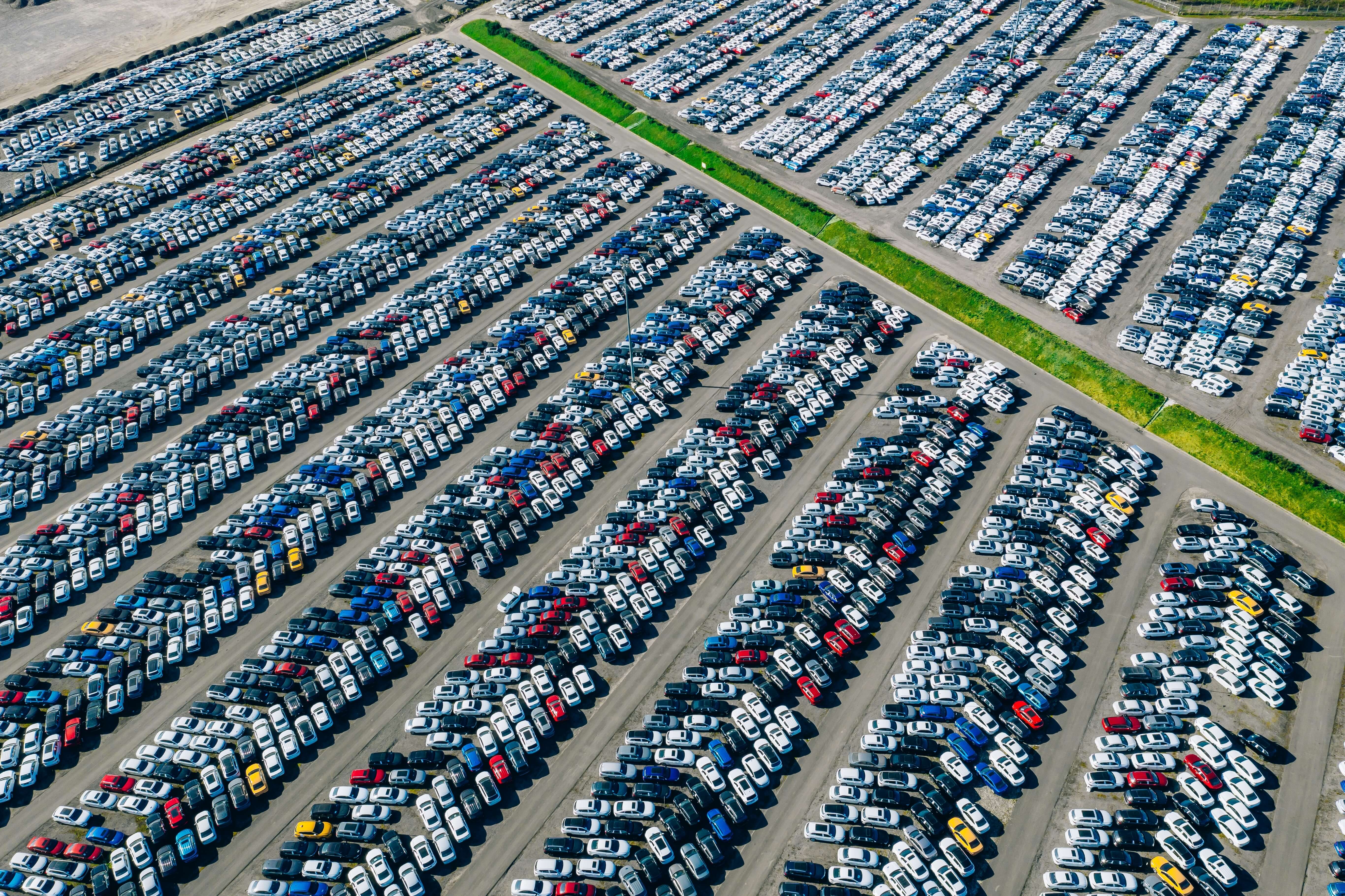 Aerial,Drone,View,Of,Parking,Lots.,New,Hybrid,Or,Electric