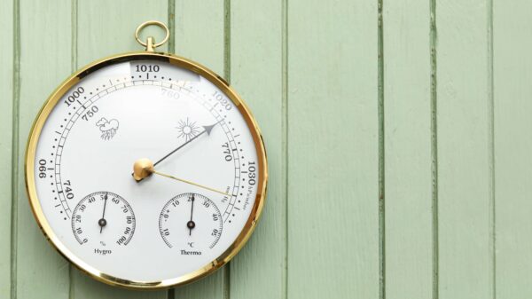 Aneroid,Barometer,On,Green,Wooden,Background