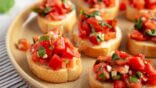 Homemade,Italian,Tomato,Bruschetta,On,A,Plate,,Side,View.,Close-up.