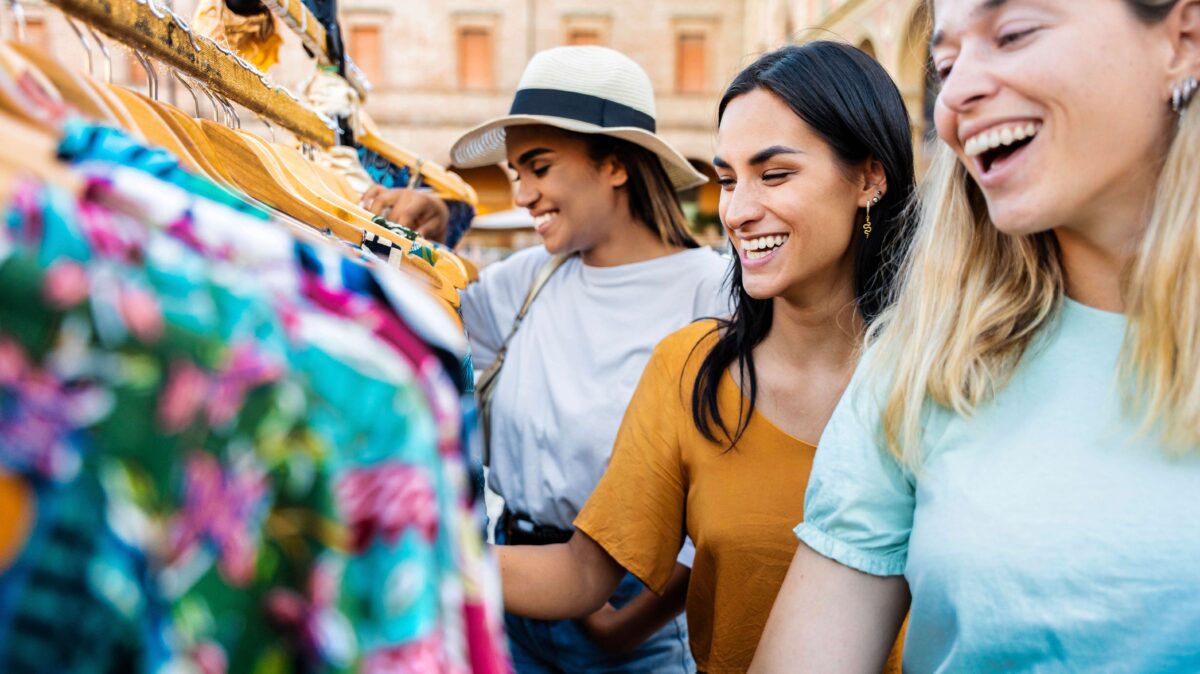 Happy,Women,Buying,Clothes,In,Second,Hand,Vintage,Market,In