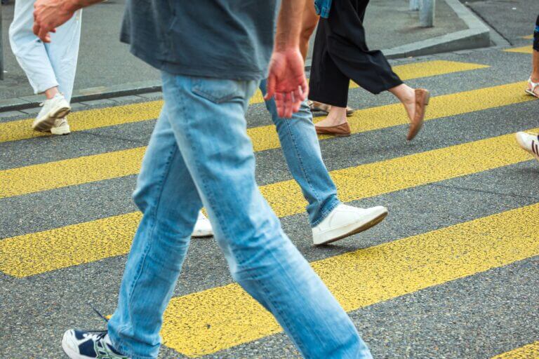 Unrecognizable,Legs,Of,People,Crossing,A,Yellow,Zebra,Or,Urban