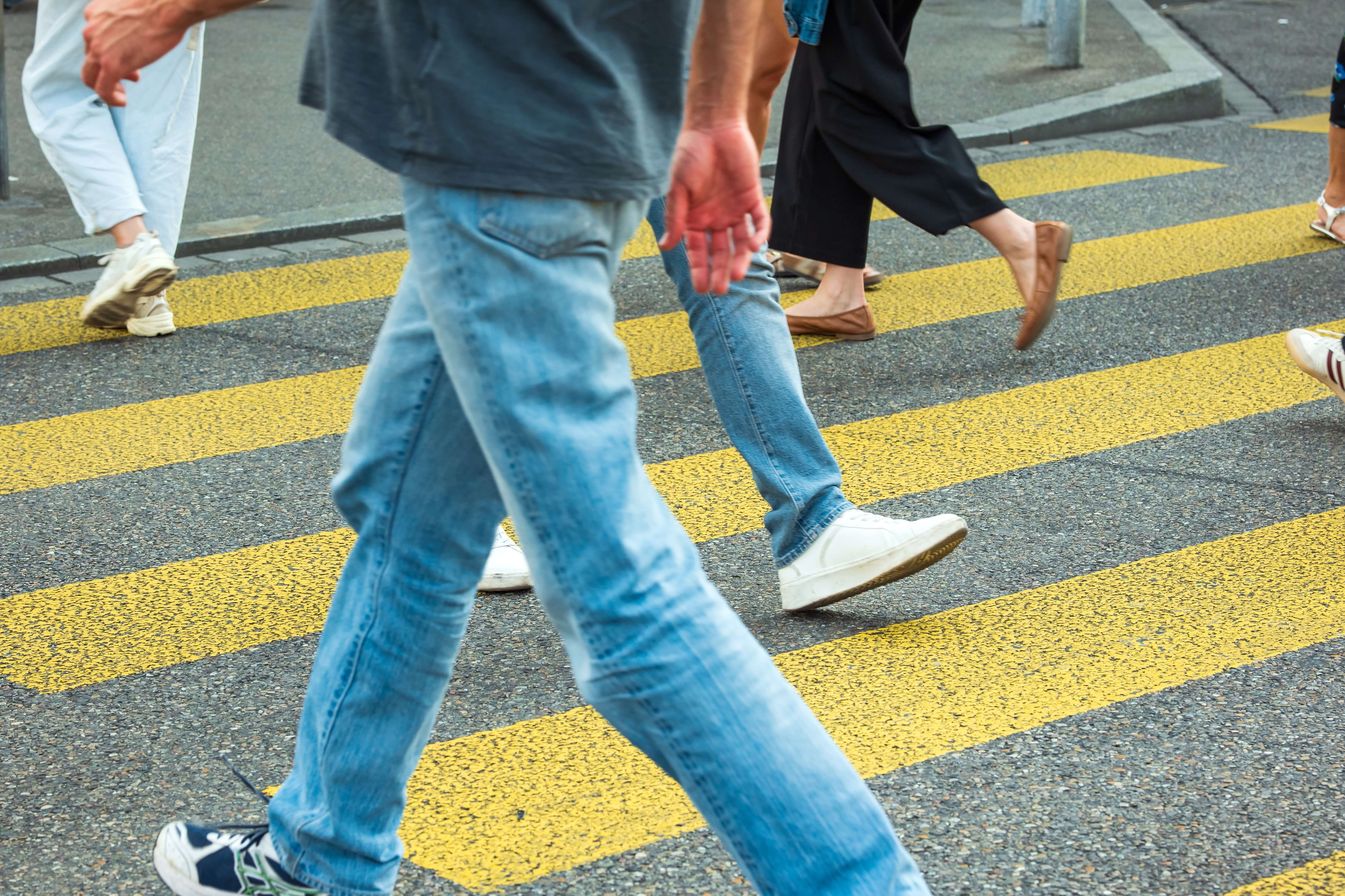 Unrecognizable,Legs,Of,People,Crossing,A,Yellow,Zebra,Or,Urban