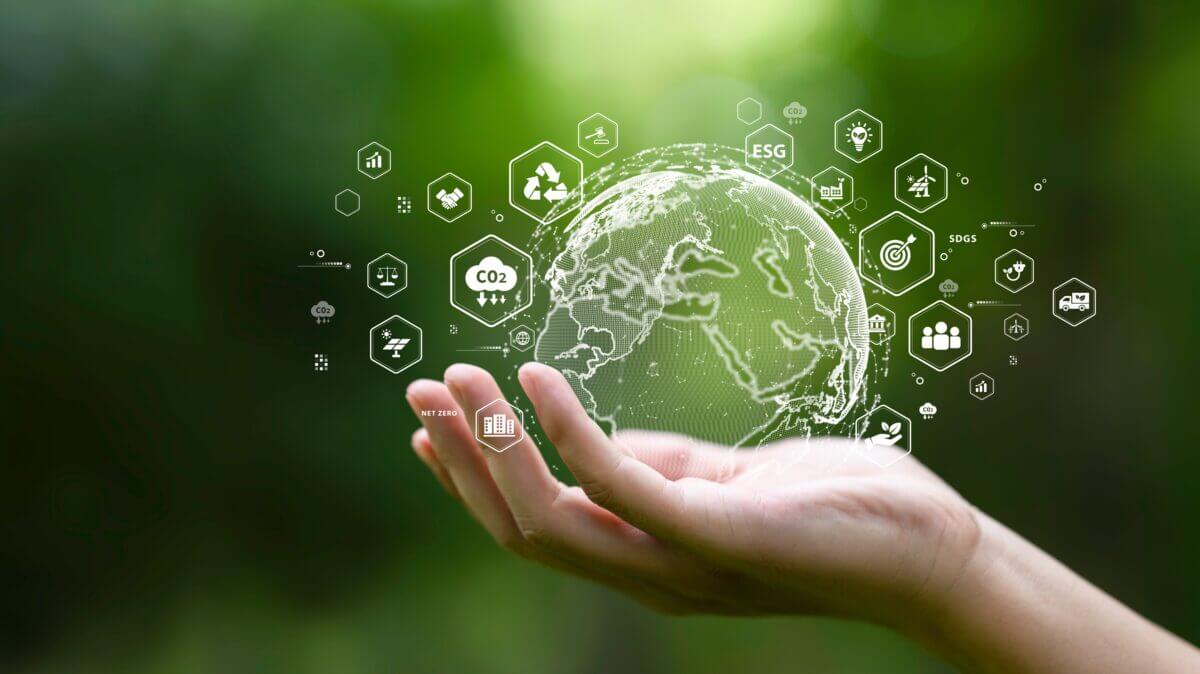 Globe,On,Hand,In,Green,Forest,With,Icon,Of,Sustainable