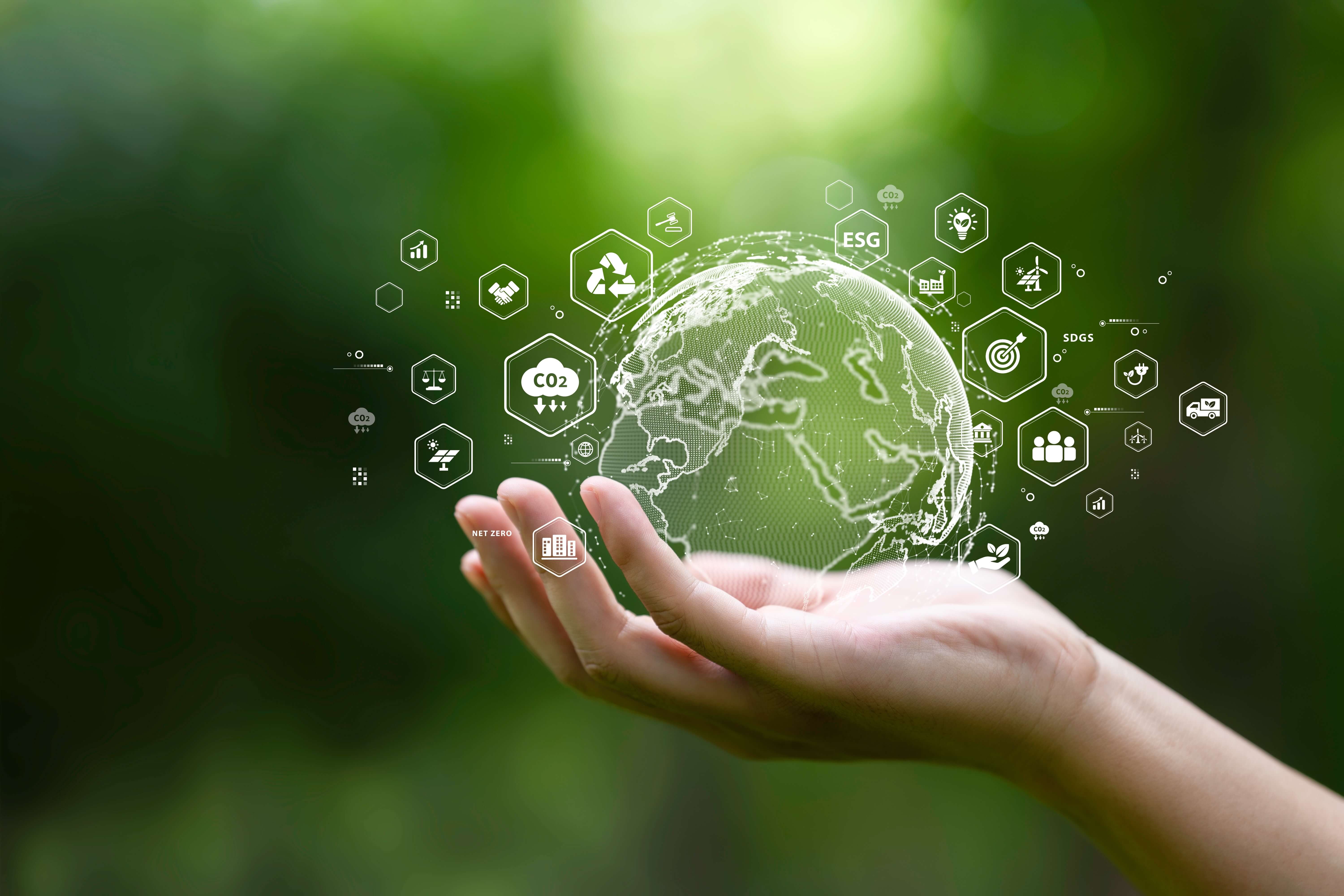 Globe,On,Hand,In,Green,Forest,With,Icon,Of,Sustainable